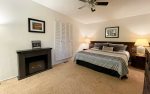 Our King master bedroom features an electric fireplace, tv, and ensuite bathroom